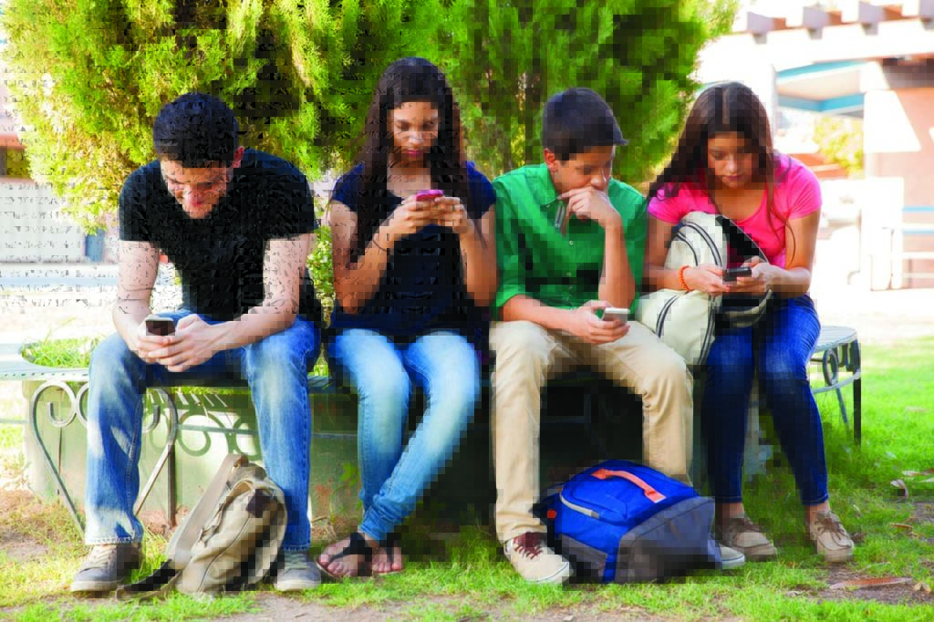 Teens busy with cellphone