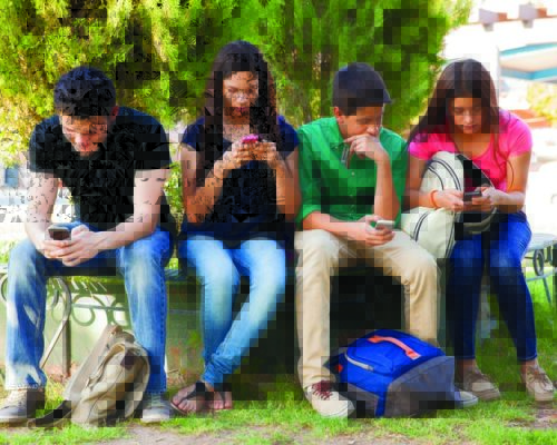 Teens busy with cellphone