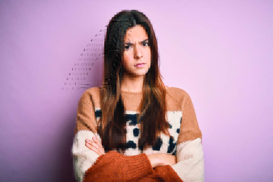 Young beautiful girl wearing casual sweater standing over isolated pink background skeptic and nervous, disapproving expression on face with crossed arms. Negative person.